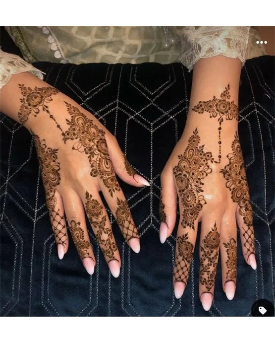 Unique Hook Art Blending Into Back Hand Mehndi Design